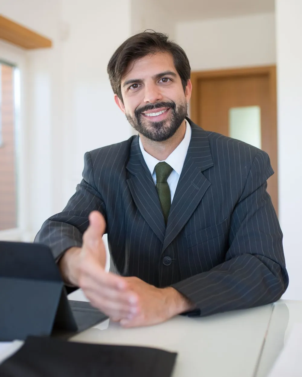 An accounting-firm owner smiling in the office
